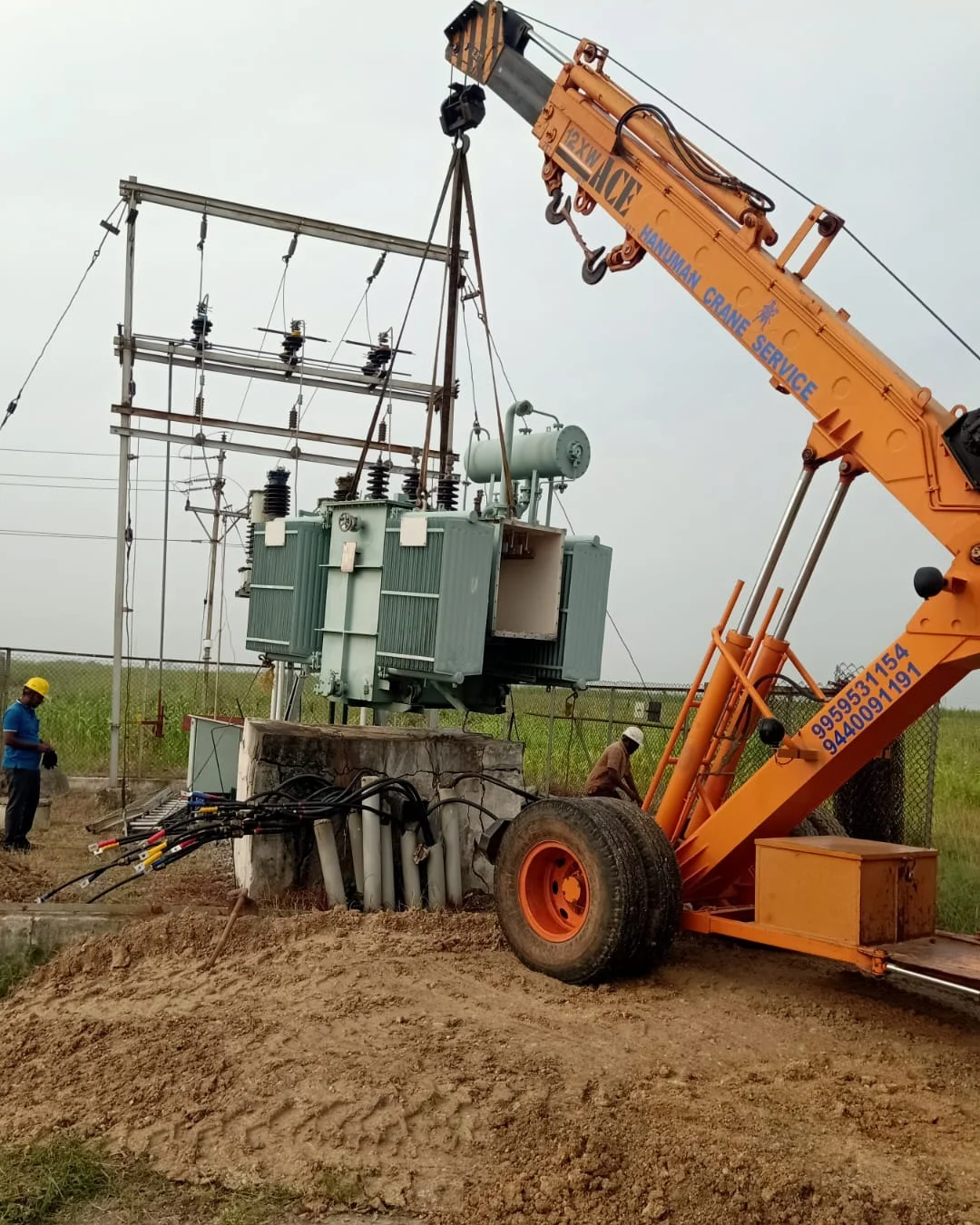 VEC crane lifting a power transformer into position at a substation site