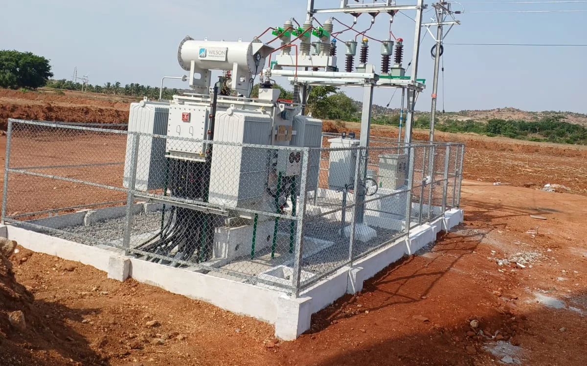 Transformer installed on a freshly completed concrete foundation with yard fencing — VEC civil and infrastructure works